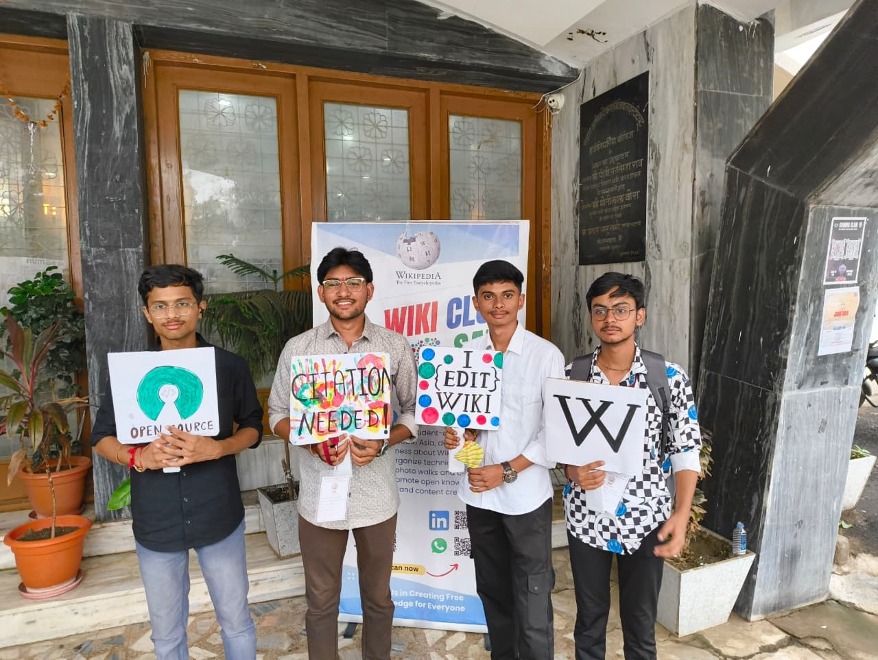 The Wiki Club at SATI (Samrat Ashok Technological Institute) hosts an interactive outreach event featuring a standee designed to promote awareness of open-source principles and the role of collaborative knowledge-sharing platforms such as Wikipedia. The standee is accompanied by cutouts of key concepts related to open-source software and community-driven editing. This initiative encourages students and faculty to engage with open-source initiatives by posing for photographs, thereby contributing to a broader dialogue on the importance of open access to information and the power of collective contribution. Through this visual engagement, the Wiki Club aims to foster greater involvement in the global open-source movement. concerning Multimodal Prompt Engineering in Gemini: Dissecting Latent Space Dynamics and Semantic Control in Generative Image Editing